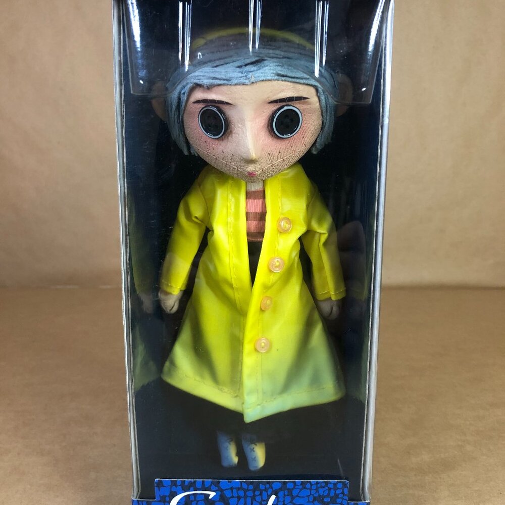NEW NECA Coraline 10" Prop Replica Doll in Yellow Raincoat - Movie Accurate